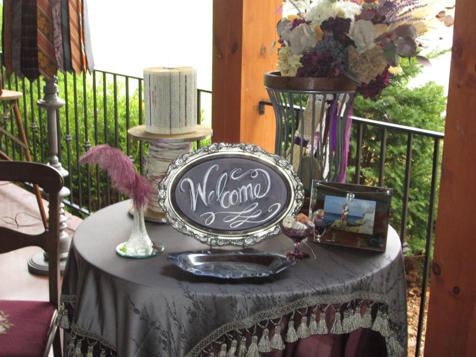 Beautiful table decor set up on the porch of Chez Lily Events.