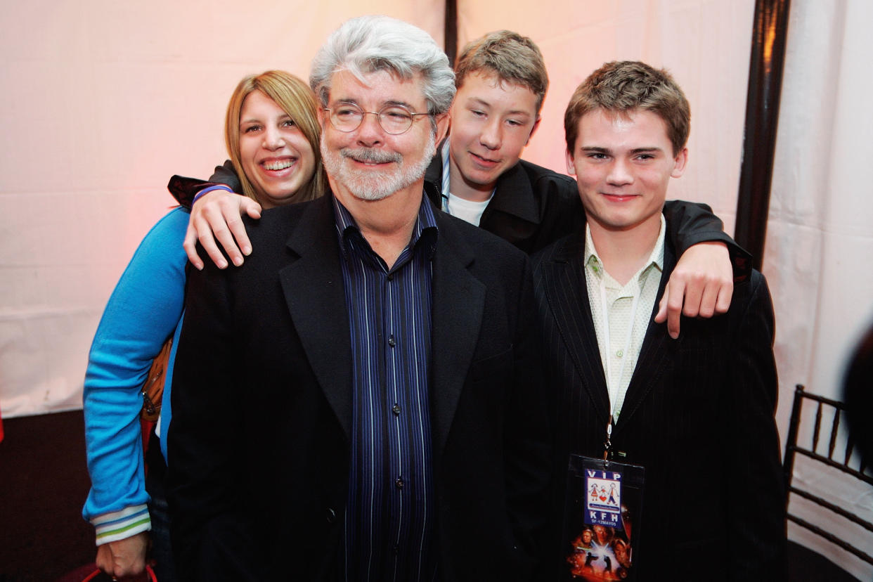 SAN FRANCISCO,  CA- MAY 12:  (L-R)  George Lucas director of Star Wars, Amanda Lucas, Jett Lucas and Jake Lloyd attend the after party of the San Francisco World Premiere of Star Wars: Episode III Revenge of the Sith at the Loews Theaters Metreon on May 12, 2005 in San Francisco, California. The Premiere was a benefit for the Koret Family House, which provides temporary housing for families of children with cancer and other serious illnesses while being treated at UCSF Children's Hospitial. (Photo by David Paul Morris/Getty Images) 