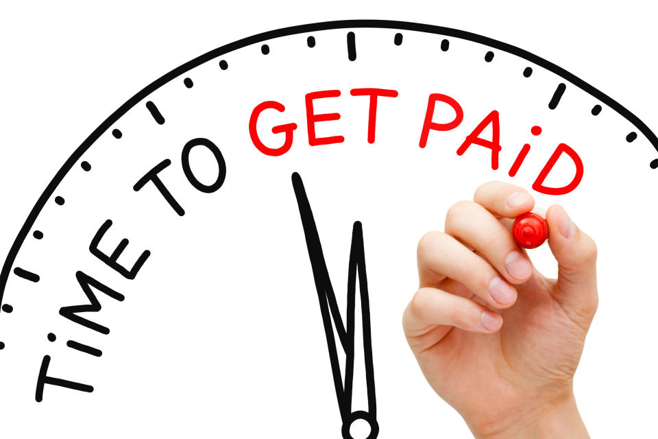 A hand holding a red marker next to part of an image of a clock, with the words "Time to Get Paid" on it -- and the words "Get Paid" are in red.