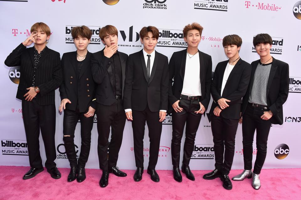 <p>Speaking of all-black, K-Pop music group BTS, who won the award for Top Social Artist, basically reenacted <em>Reservoir Dogs</em> in coordinated skinny black suits on the red carpet. They also all have the same exact haircut. (And Zayn Malik thought he had it hard.)</p>