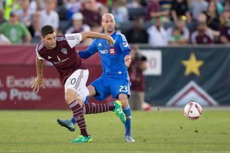 Oct 10, 2015; Commerce City, CO, USA; Colorado Rapids defender Joseph Greenspan (20) battles with Montreal Impact defender Laurent Ciman (23) for the ball in the second half at Dick's Sporting Goods Park. The Impact defeated the Rapids 1-0. Mandatory Credit: Isaiah J. Downing-USA TODAY Sports