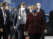 Germany's Chancellor Angela Merkel arrives for an EU summit in Brussels, Friday, Oct. 22, 2021. European Union leaders conclude a two-day summit on Friday in which they discuss issues such as climate change, the energy crisis, COVID-19 developments and migration. (Olivier Hoslet, Pool Photo via AP)