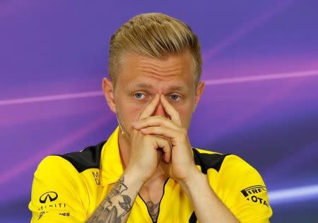 Renault's F1 driver Kevin Magnussen gestures during a news conference ahead of the Spanish Grand Prix. REUTERS/Albert Gea