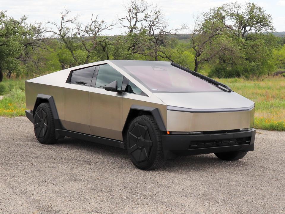 Tesla Cybertruck (front view) in front of a natural landscape