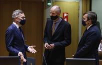 Minister of State for Europe at the German Federal Foreign Office Michael Roth, left, speaks with Dutch Minister of Foreign Affairs Stef Blok, center, and Italian Minister of European Affairs Vicenzo Amendola, right, during a meeting of the General Affairs Council at the European Council building in Brussels, Tuesday, Sept. 22, 2020. European Union ministers meet Tuesday to discuss the stalemate in the Brexit negotiations and prospects to avoid a no-deal cliff-edge transition at the end of the year. (Aris Oikonomou, Pool via AP)