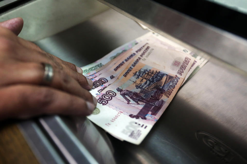 Russian 500 and 1000 denomination ruble banknotes sit in a cashier's tray in London, U.K.