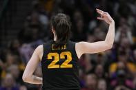Iowa's Caitlin Clark reacts after a three pointer during the second half of an NCAA Women's Final Four semifinals basketball game against South CarolinaFriday, March 31, 2023, in Dallas. (AP Photo/Tony Gutierrez)