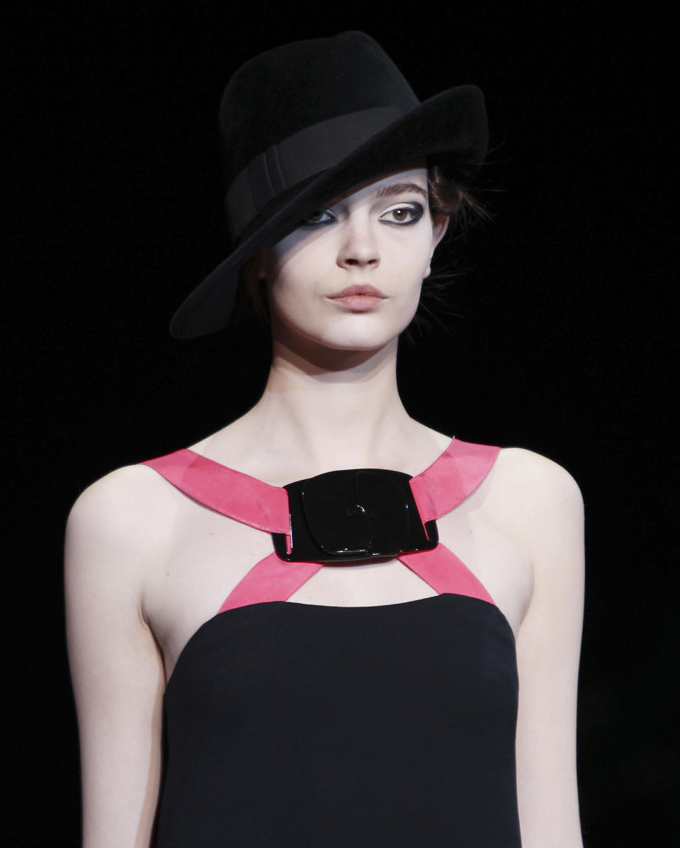 A model wears a creation part of the Giorgio Armani Women's Fall-Winter 2012-13 fashion collection, during the fashion week in Milan, Italy, Monday, Feb. 27, 2012. (AP Photo/Antonio Calanni)