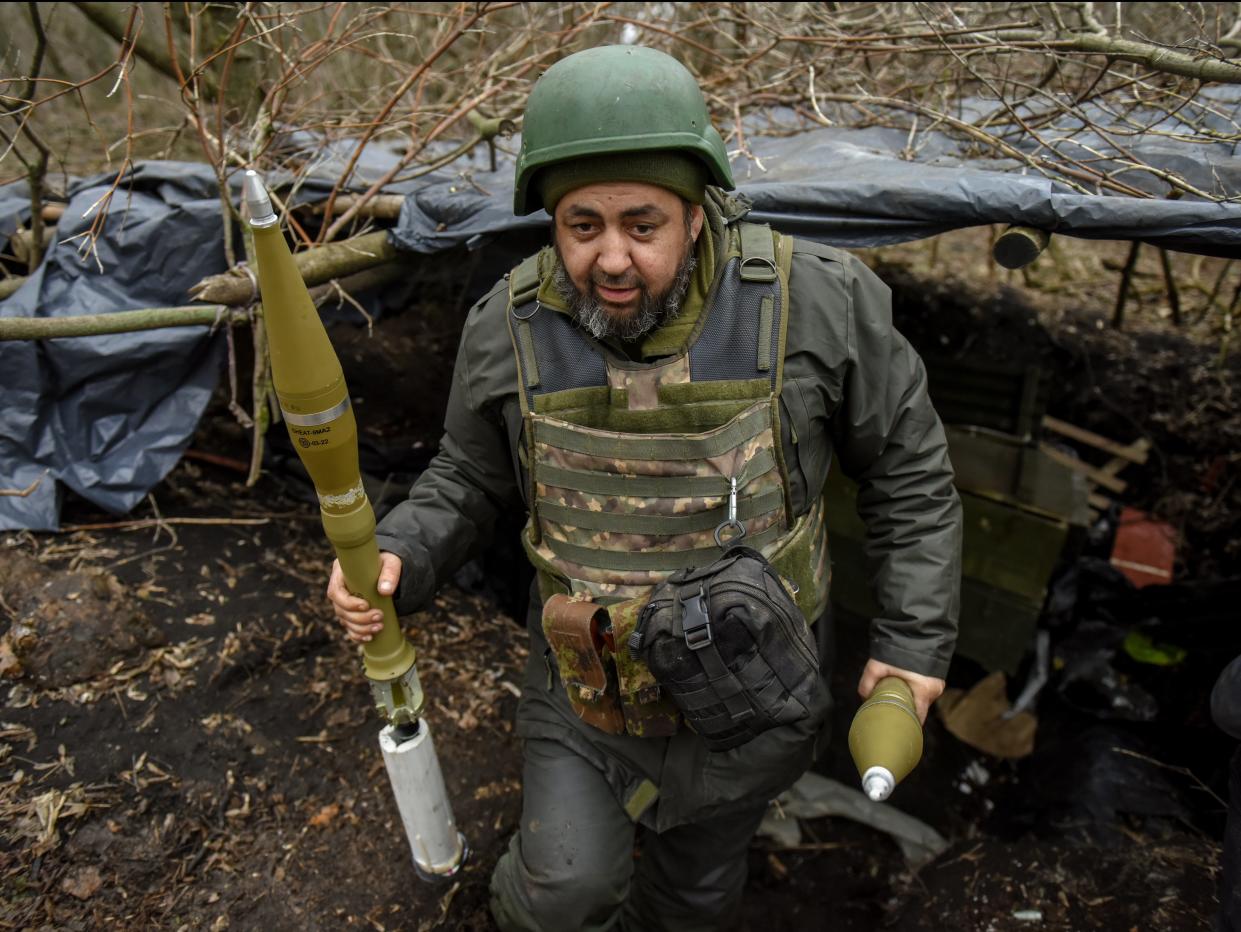 Ukrainian servicemen prepare an anti-tank rocket launcher (EPA)