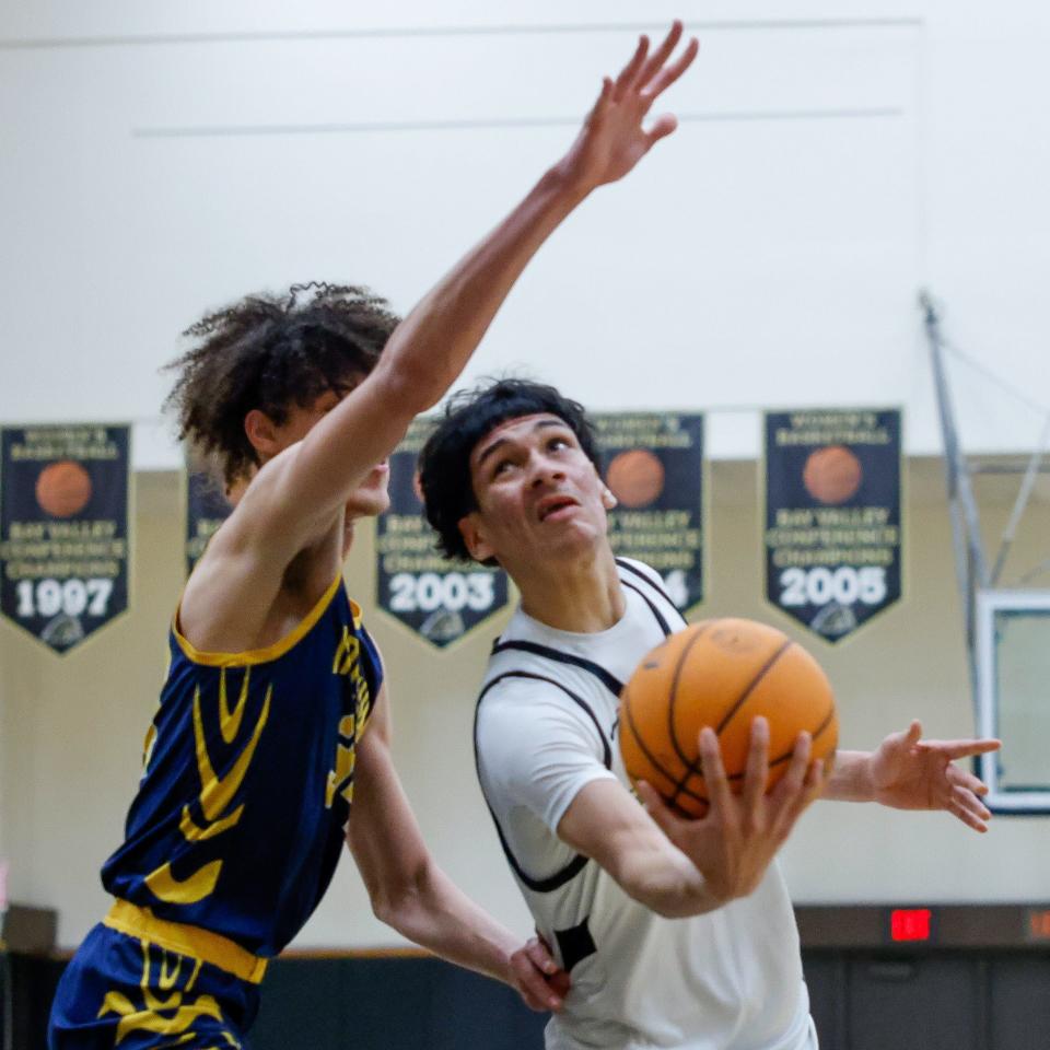 Rams Daniel Huerta(11) gets creative to get two during their 80-57 loss against Inderkum High of Sacramento at the Super Saturday Showcase event, held at Blanchard Gymnasium on the Delta College campus in Stockton, CA