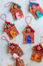 <p>You can hang these on a door, on the tree or wherever else you need a dose of good cheer. Bonus: Made from craft sticks, beads and other common art supplies, they're less of a crummy mess than a real gingerbread house.</p><p><a href="https://studiodiy.com/diy-popsicle-stick-gingerbread-house-ornaments/" rel="nofollow noopener" target="_blank" data-ylk="slk:Get the tutorial at Studio DIY »;elm:context_link;itc:0;sec:content-canvas" class="link "><em>Get the tutorial at Studio DIY »</em></a></p>