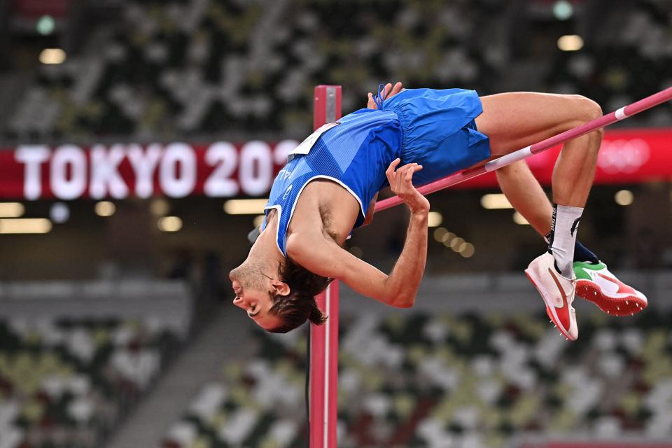 <p>Italy's Gianmarco Tamberi competes in the men's high jump final during the Tokyo 2020 Olympic Games at the Olympic Stadium in Tokyo on August 1, 2021. (Photo by Ben STANSALL / AFP) (Photo by BEN STANSALL/AFP via Getty Images)</p> 