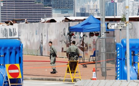 Police officers stand guard outside the Legislative Council Complex, in central Hong Kong