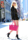 Celebrities in neon fashion: Taylor Momsen wore her neon pink bag with an all-black look in New York.<br><br>[Rex]