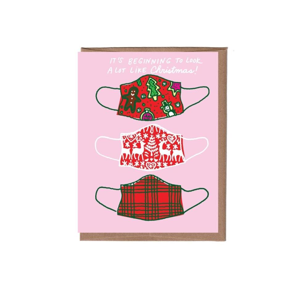 Buy it from <a href="https://www.etsy.com/listing/869366057/christmas-masks-holiday-card" target="_blank" rel="noopener noreferrer">lafamiliagreen on Etsy</a> for $5