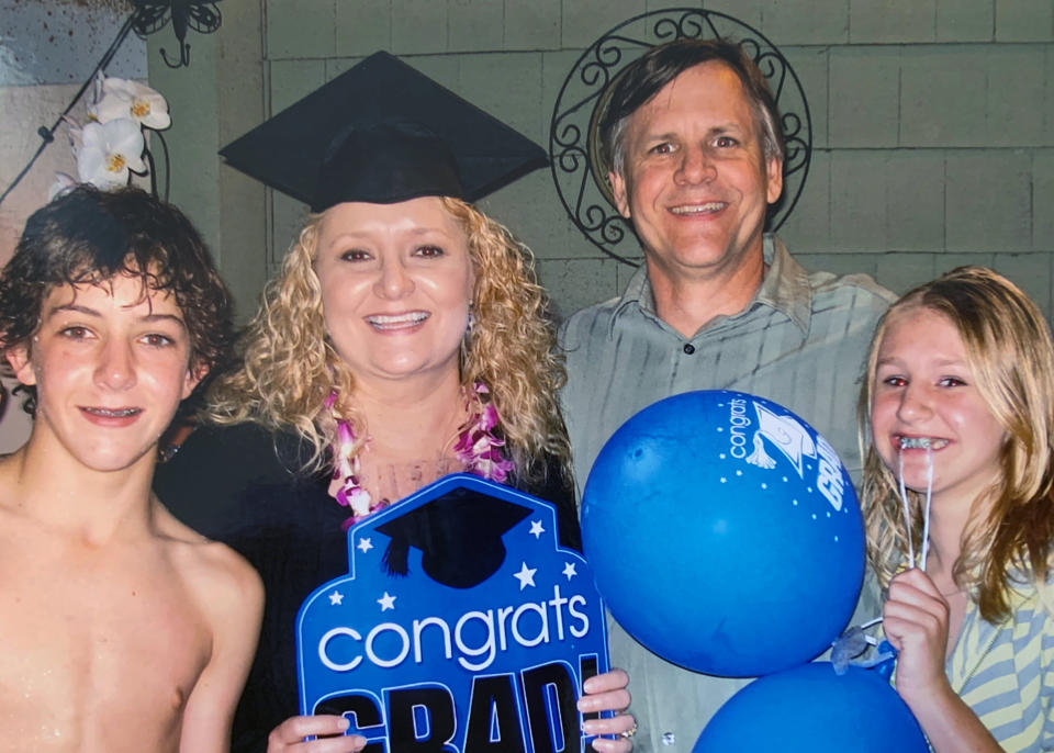 This 2009 photo provided by the Biel family, shows the late Kristen Biel, at her graduation party, with her husband Darryl Biel and their two children, Dylan and Delaney. On Monday, the Supreme Court will hear arguments in a disability discrimination lawsuit she filed against her former employer, St. James Catholic School in Torrance, California. A judge initially sided with the school and halted the lawsuit, but an appeals court disagreed and said it could go forward. (Biel family photo via AP)
