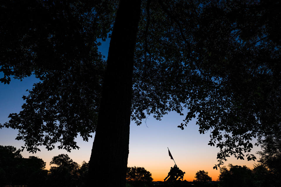 <p>Sunrise silhouettes the U.S. Marine Corps Memorial in Arlington, Va. on a cloudless summer morning in the Nation’s Capital area Tuesday, Aug. 23, 2016. (AP Photo/J. David Ake) </p>