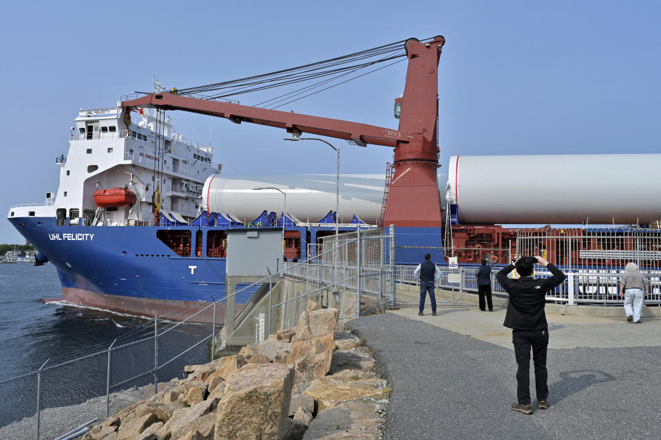 The ship UHL Felicity carrying wind turbine tower sections passes the hurricane barrier, Wednesday, May 24, 2023, to dock in New Bedford, Mass. Once assembled by developer Vineyard Wind, the turbines at sea will stand more than 850 feet high. (AP Photo/Josh Reynolds)