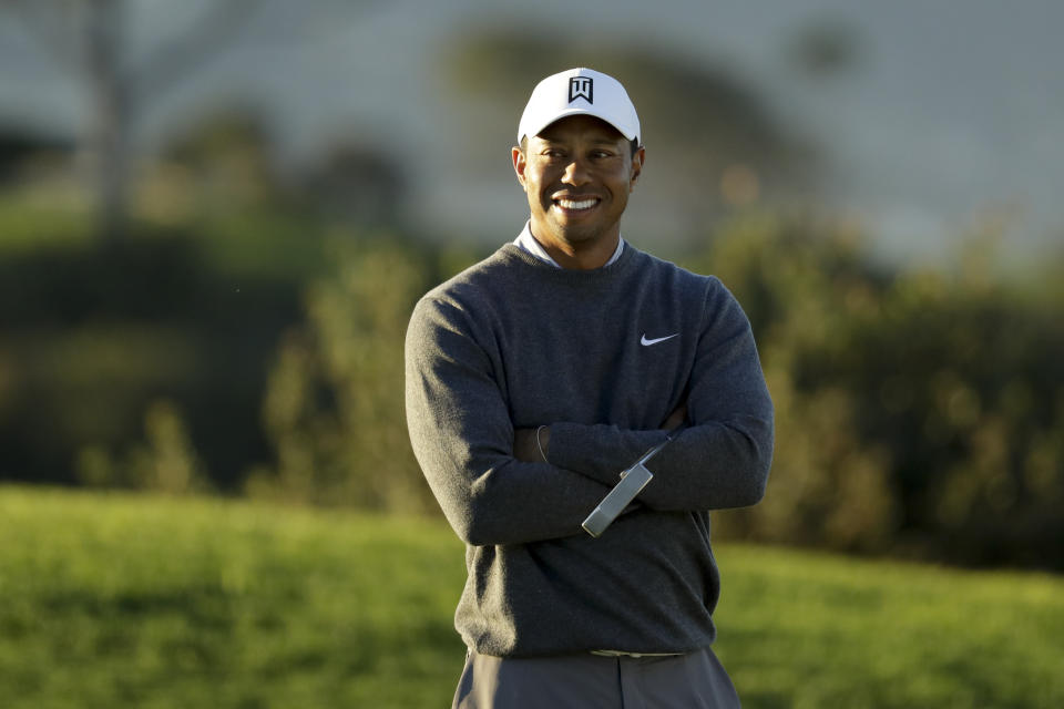 Tiger Woods smiles on the third green during the pro-am round of the Farmer's Insurance Open golf tournament on the North Course at Torrey Pines Golf Course on Wednesday, Jan. 23, 2019, in San Diego, Calif. (AP Photo/Chris Carlson)