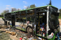 A damaged bus is seen after an explosion yesterday at insurgent-held al-Rashideen, Aleppo province, Syria April 16, 2017. REUTERS/Ammar Abdullah