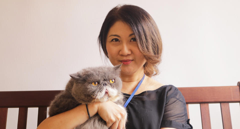 Owner Jessica Seet with her first cat, Brad Pitt. (Photo: Gabriel Choo / Yahoo Lifestyle Singapore)