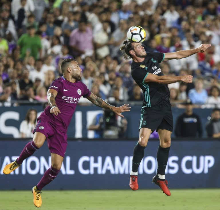 Real Madrid's Gareth Bale (R) heads the ball away from Manchester City's Danilo during their International Champions Cup match, at the Los Angeles Memorial Coliseum, on July 26, 2017