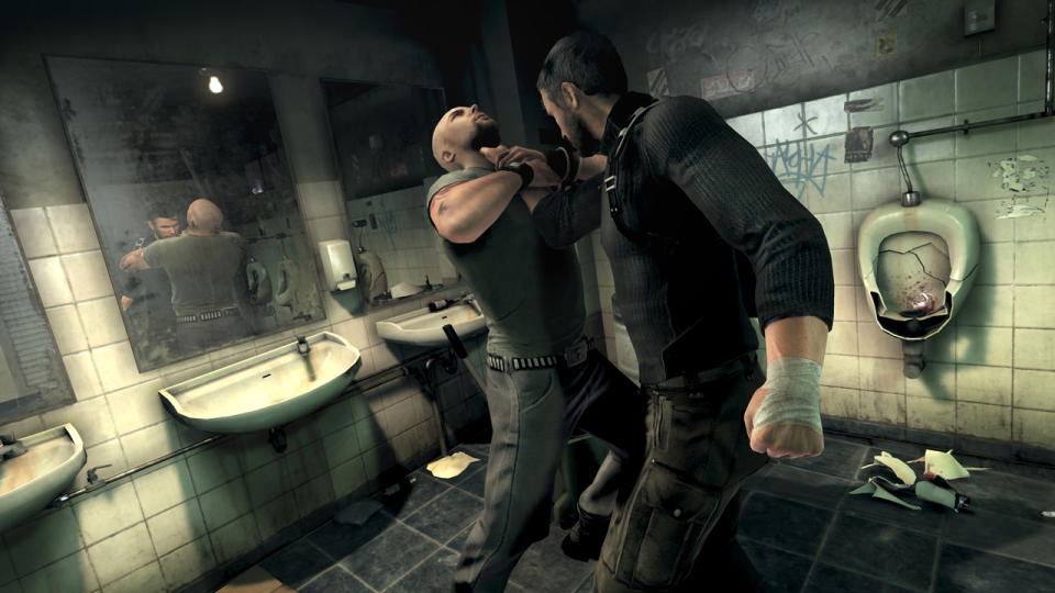 Sam Fisher grapples with a man in a smashed up bathroom