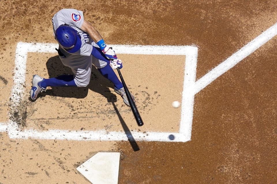 Chicago Cubs' Dansby Swanson hits a double during the second inning of a baseball game against the Milwaukee Brewers Monday, July 3, 2023, in Milwaukee. (AP Photo/Morry Gash)
