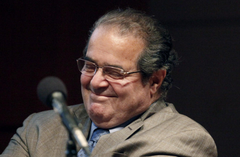 FILE - In this Oct. 18, 2011, file photo U.S. Supreme Court justice Antonin Scalia smiles during a college address in Chicago. Scalia said late Wednesday July 18, 2012, that he hasn't had a "falling out" with Chief Justice John Roberts over the Supreme Court's landmark 5-4 decision validating much of President Barack Obama's health care overhaul."There are clashes on legal questions but not personally," Scalia said of the court. (AP Photo/Charles Rex Arbogast, File)