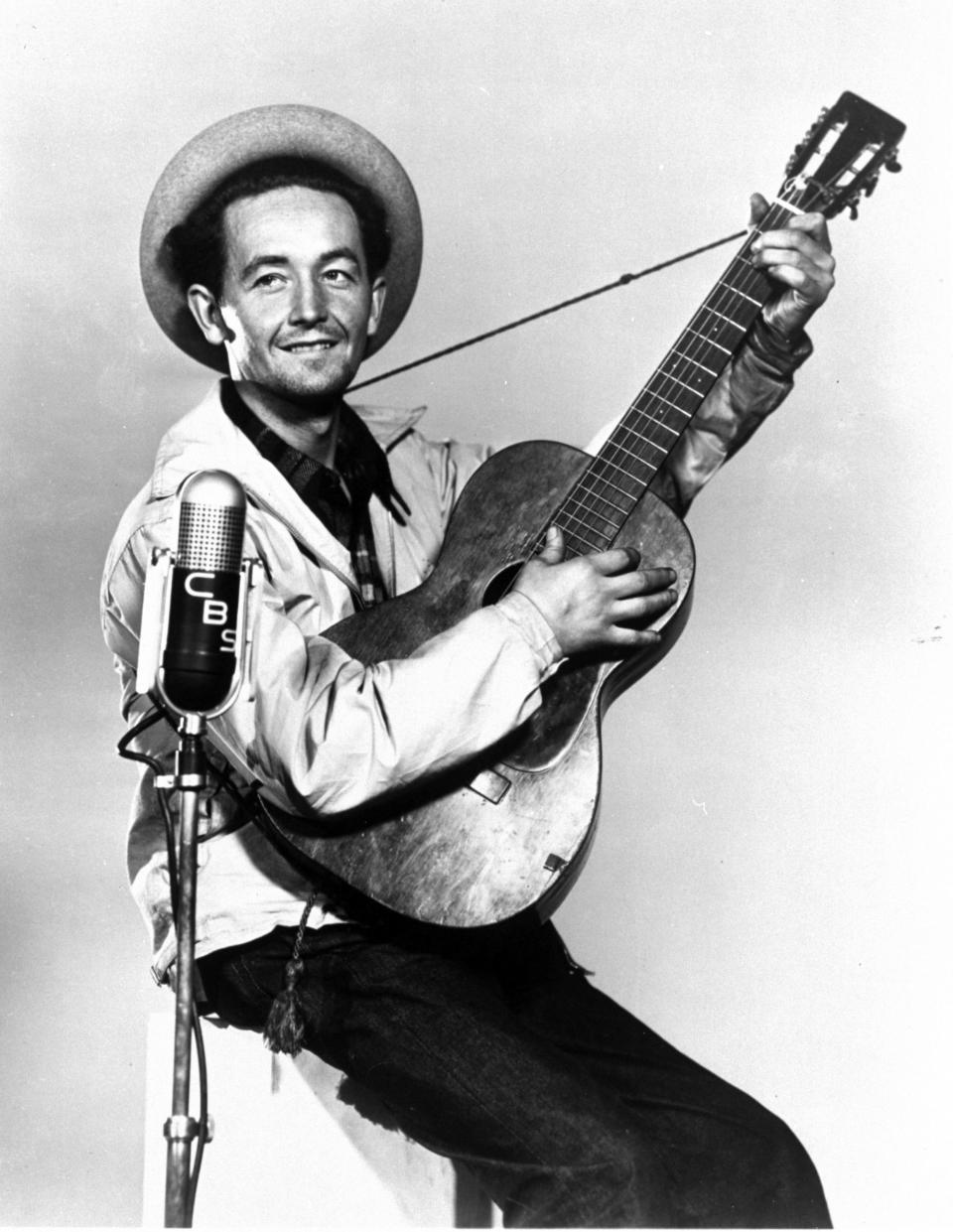 A 1944 file photo shows singer-songwriter Woody Guthrie, the dean of American folk music.