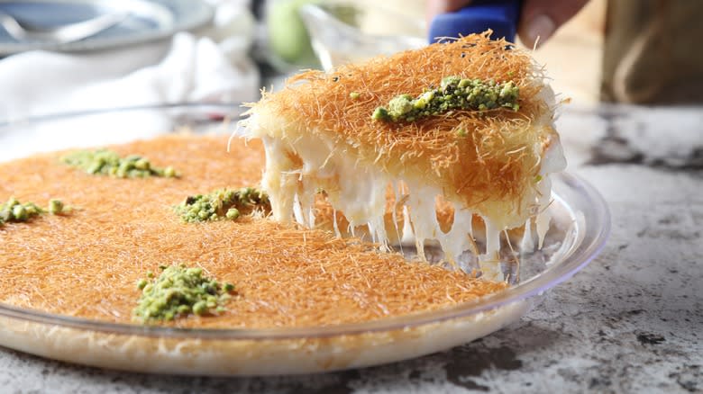 knafeh with slice being removed