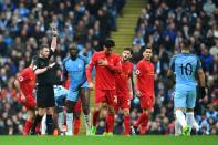 <p>Yaya Toure is booked by Michael Oliver, perhaps fortunate to avoid a red </p>