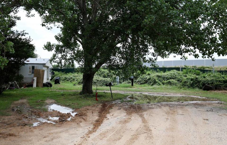 A 20-foot wall was built around a bitcoin mining facility operating in unincorporated Hood County to shield the neighboring mobile home park from noise, as seen on Wednesday, May 29, 2024.