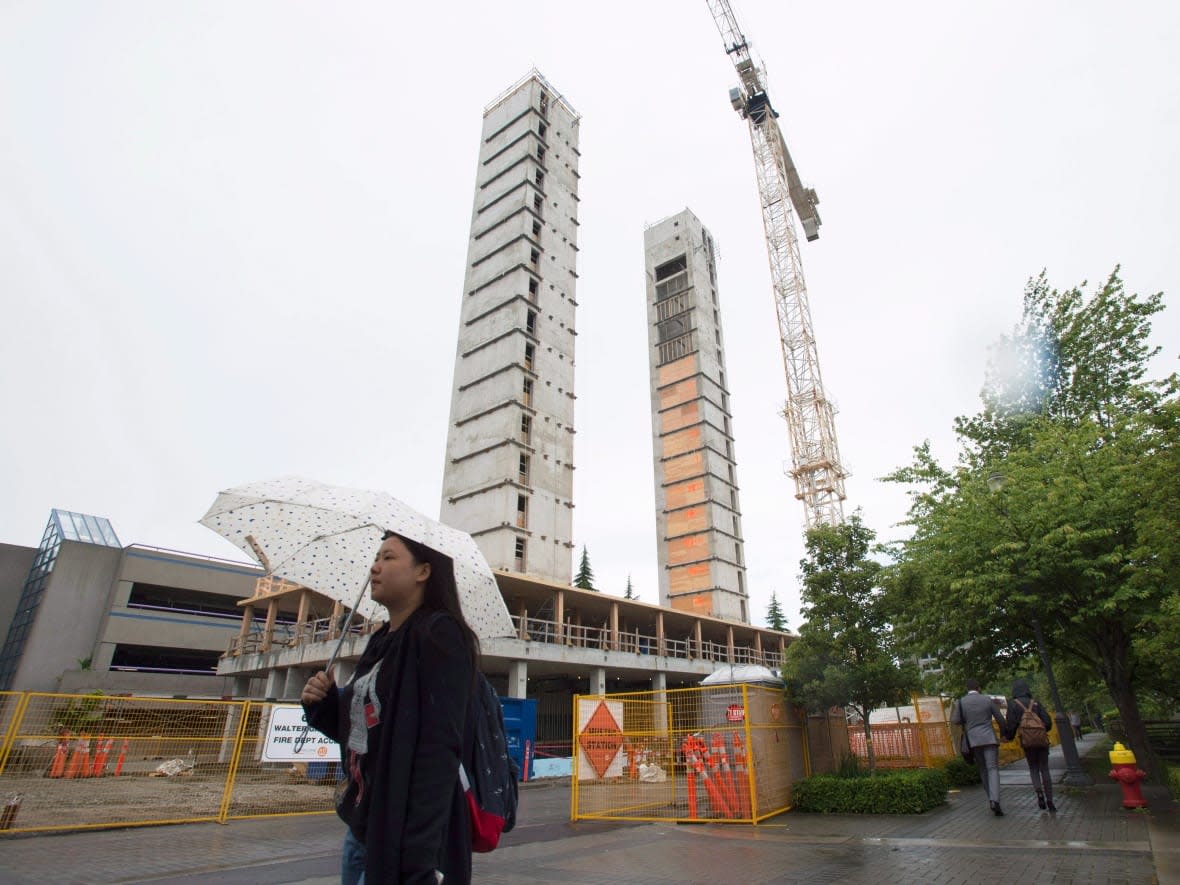 The 18-storey Brock Commons Tallwood House, seen under construction in June 2016, is a student residence at Vancouver's University of British Columbia that was built with mass timber. (Jonathan Hayward/The Canadian Press - image credit)