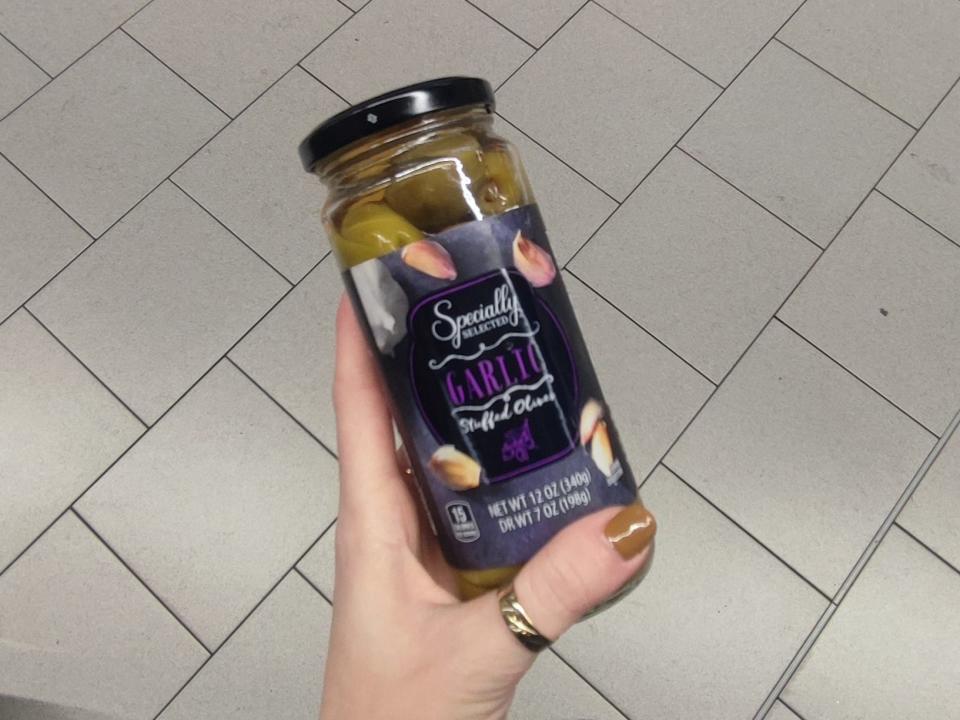 A jar of Specially Selected garlic-stuffed olives.