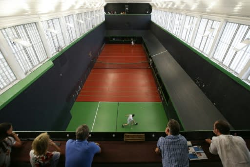 Nick Howell and Ben Taylor-Matthews (top) play a match at the Real Tennis Champions Trophy at Hampton Court Palace, south-west London, on July 20, 2018