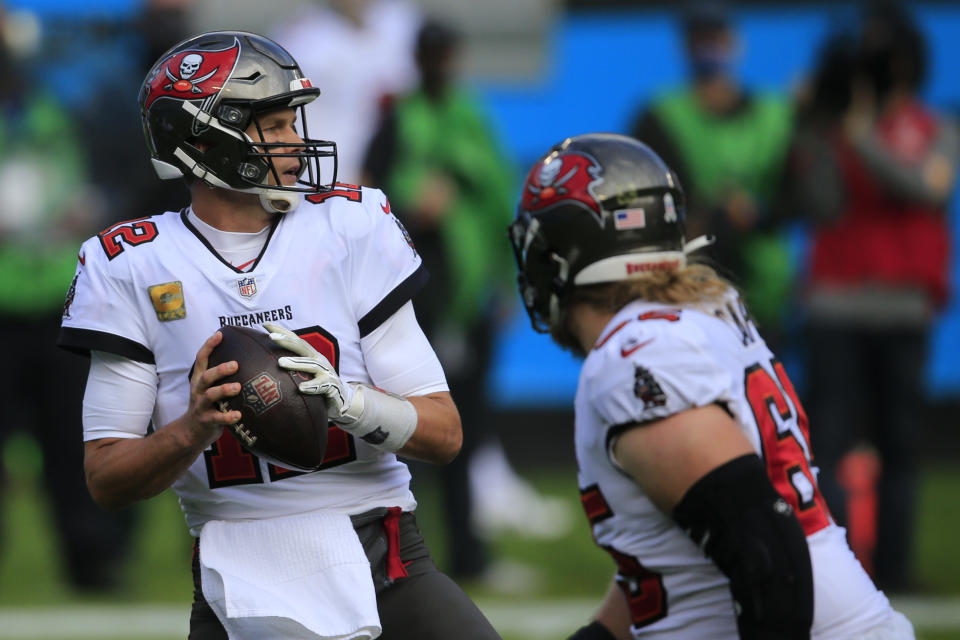 Tampa Bay Buccaneers quarterback Tom Brady (12) works against the Carolina Panthers during the first half of an NFL football game, Sunday, Nov. 15, 2020, in Charlotte , N.C. (AP Photo/Brian Blanco)