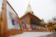 Portraits of victims of a fatal 1997 grenade attack on an opposition rally are displayed during a ceremony to remember the victims at a monument in Phnom Penh, Cambodia, March 30, 2018. REUTERS/Samrang Pring