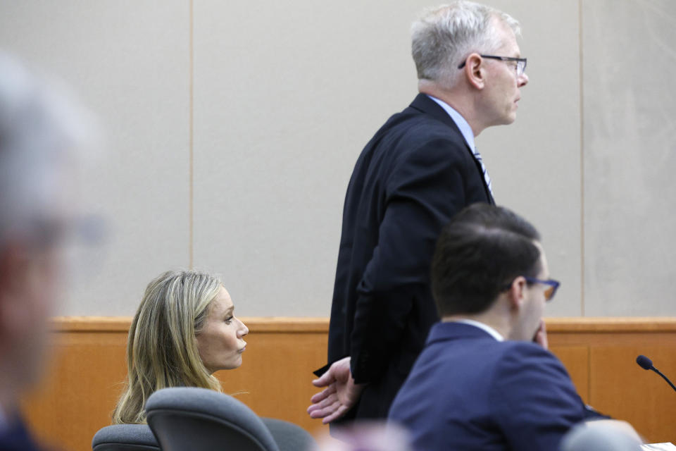 Gwyneth Paltrow, left, sits in court, Thursday, March 23, 2023, in Park City, Utah, where she is accused in a lawsuit of crashing into a skier during a 2016 family ski vacation, leaving him with brain damage and four broken ribs. Terry Sanderson claims that the actor-turned-lifestyle influencer was cruising down the slopes so recklessly that they violently collided, leaving him on the ground as she and her entourage continued their descent down Deer Valley Resort, a skiers-only mountain known for its groomed runs, après-ski champagne yurts and posh clientele. (AP Photo/Jeff Swinger, Pool)