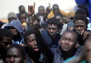 <p>Migrants rest after they were rescued by the Libyan Coast Guard, at a naval post in the coastal town of Tajoura, east of Tripoli, Libya, May 23, 2017. (Photo: Ismail Zitouny/Reuters) </p>