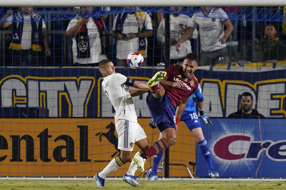 LA Galaxy forward Dejan Joveljic, left, attempts to head the ball as Real Salt Lake defender Marcelo Silva defends during the first half of an MLS soccer match Saturday, Oct. 14, 2023, in Carson, Calif. (AP Photo/Ryan Sun)