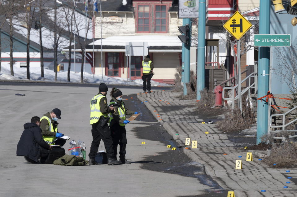 Police officers investigate the scene of a fatal accident, Tuesday, March 14, 2023 in Amqui Quebec. (Jacques Boissinot/The Canadian Press via AP)
