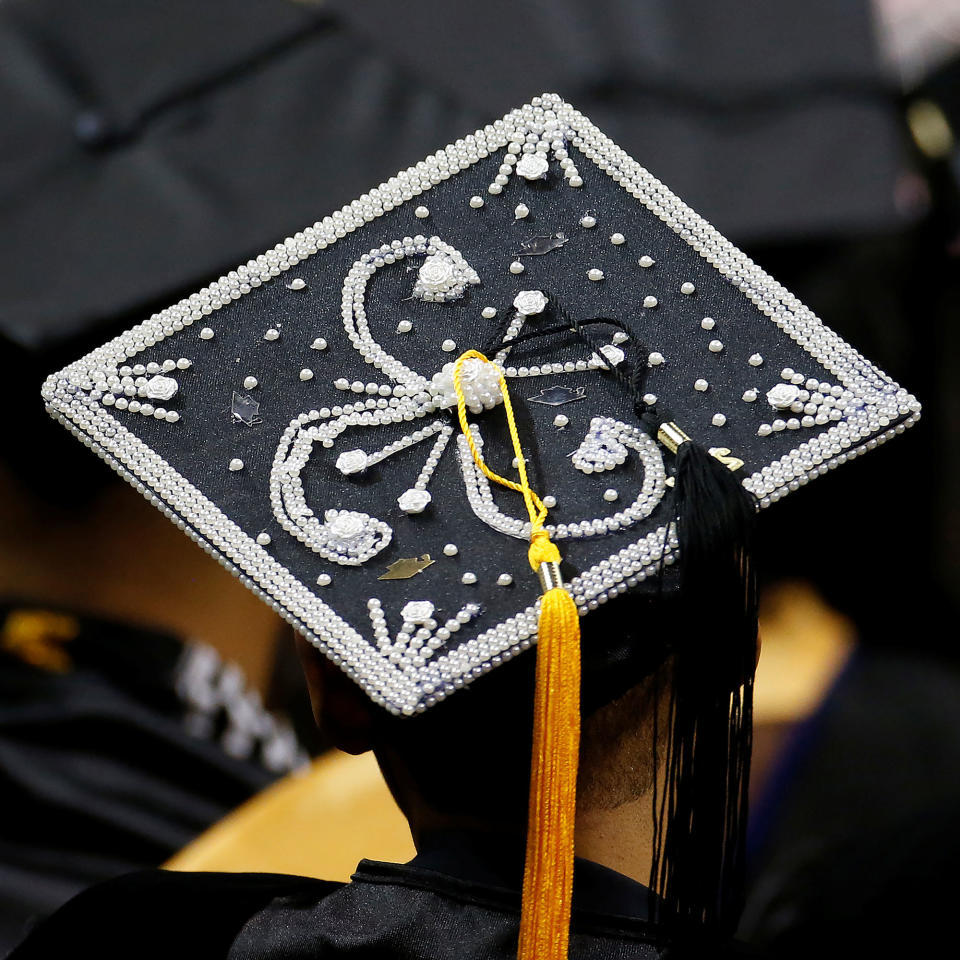 A graduate’s decorated mortar board hat