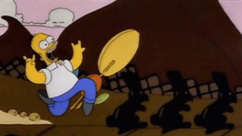 Homer Simpson prancing with chocolate bunnies
