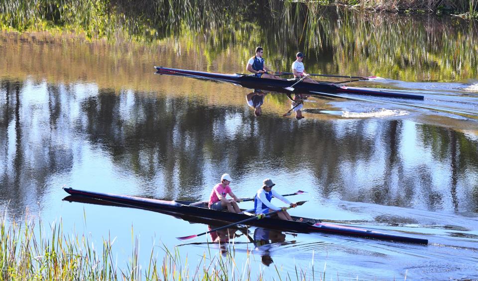 Florida Tech men’s varsity rowers and women’s club rowers train during an early morning March session in the C-54 Canal in Fellsmere.