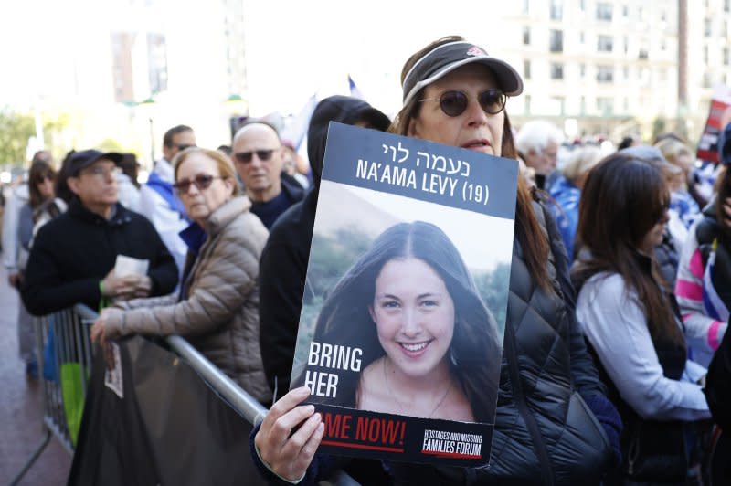 Pro-Israeli counter-protesters hold signs featuring the hostages taken in the Oct. 7 Hamas attacks outside of Columbia University. Photo by John Angelillo/UPI