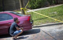 <p>Calvin McNeil, who was in the Pulse nightclub at the time of a mass shooting, returns to the scene to look for his car, June 13, 2016, in Orlando, Fla. (AP Photo/David Goldman) </p>