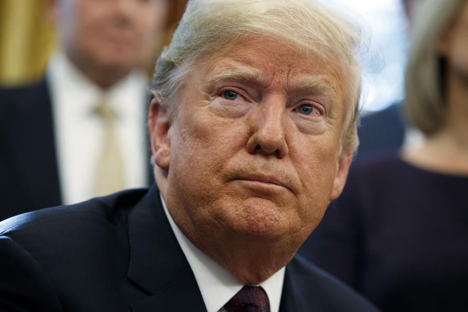 President Donald Trump listens to a question during a signing ceremony of the "Cybersecurity and Infrastructure Security Agency Act," in the Oval Office of the White House, Friday, Nov. 16, 2018, in Washington. (AP Photo/Evan Vucci)