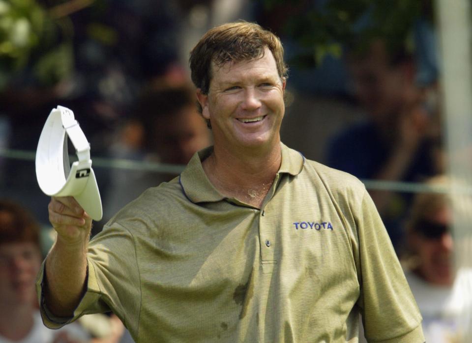 Peter Jacobsen celebrates after his birdie putt on the fourth green during the final round of the Greater Hartford Open on July 27, 2003 at TPC at River Highlands in Cromwell, Connecticut. (Photo by Elsa/Getty Images)