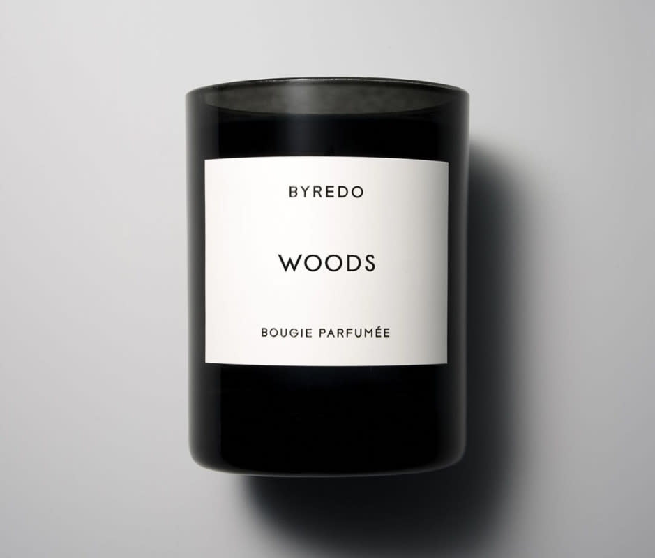 <p> Byredo's immensely popular candle line draws inspiration from the homemade candles of founder Ben Gorham's Swedish grandmother, adding a touch of authenticity and relatability to the brand's narrative. The candles, hand-poured in the brand's signature black wax crafted from a blend of vegetable and beeswax, exude a hushed and luxurious subtlety. Woods marries a top note of raspberry with undertones of leather and cedarwood. The result is an olfactory journey that artfully transports one through a woodland forest in a uniquely Byredo way. </p>